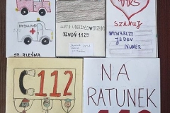 Prace konkursowe rozłożone na stoliku