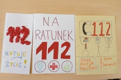 Prace konkursowe rozłożone na stoliku