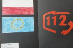 Praca plastyczna, rozłożona kartka, z lewej strony flaga polski i Unii Europejskiej