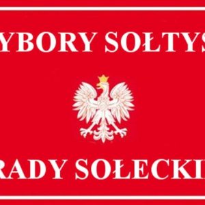 czerwona tablica z polskim godłem