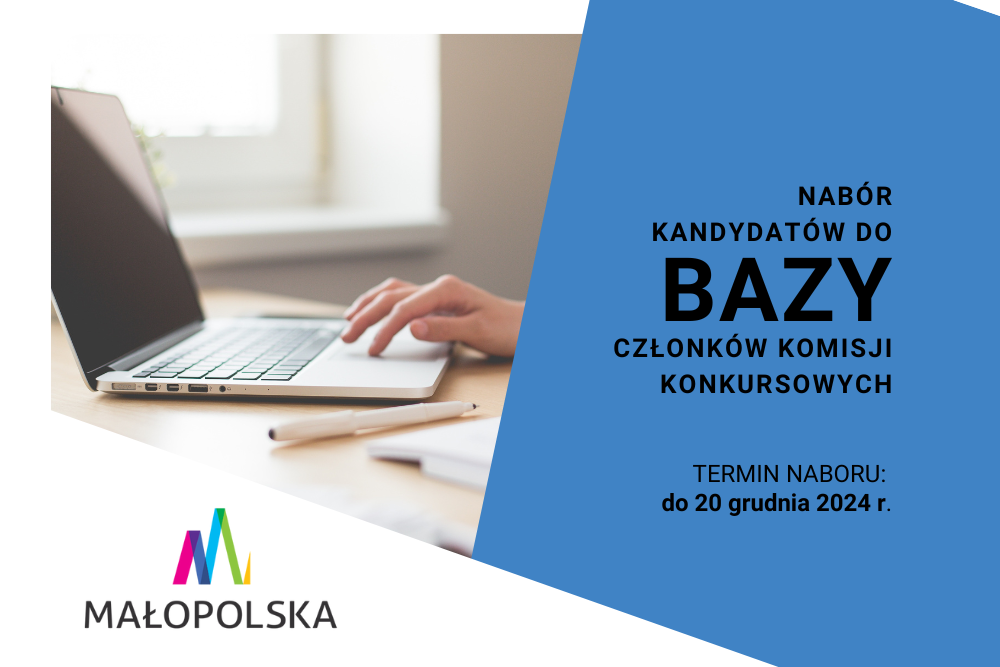 Dłoń pracuje na touchpadzie laptopa, obok leży biały długopis